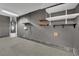 Spacious garage with built in shelving, water heater and painted walls at 1676 Divinity St, Las Vegas, NV 89142