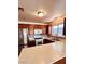Well-lit kitchen featuring stainless steel appliances, dark cabinets, and a light countertop space at 1676 Divinity St, Las Vegas, NV 89142