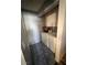 Functional laundry room featuring a washer, dryer, and overhead cabinets for efficient storage and organization at 1676 Divinity St, Las Vegas, NV 89142