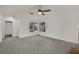 Cozy living room with natural light and ceiling fan at 1676 Divinity St, Las Vegas, NV 89142