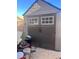 Outdoor storage shed with double doors, providing ample space for tools and equipment at 1676 Divinity St, Las Vegas, NV 89142