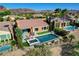 Aerial view showcasing backyard pool, spa, landscaping and mountain views at 19 Contrada Fiore Dr, Henderson, NV 89011