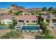 Aerial view of backyard with swimming pool, spa, patio and a view of mountains at 19 Contrada Fiore Dr, Henderson, NV 89011