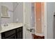 Bathroom featuring a vanity with storage and a view of the adjacent hallway at 19 Contrada Fiore Dr, Henderson, NV 89011