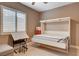 Neutral bedroom featuring a Murphy bed, desk, and unique Coca-Cola refrigerator at 19 Contrada Fiore Dr, Henderson, NV 89011