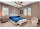 Inviting bedroom featuring marine themed decor, comfortable seating, and ample natural light at 19 Contrada Fiore Dr, Henderson, NV 89011