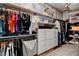 Spacious walk-in closet with custom shelving and storage solutions for organization at 19 Contrada Fiore Dr, Henderson, NV 89011