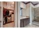 A primary walk-in closet that has built in shelving and racks at 19 Contrada Fiore Dr, Henderson, NV 89011