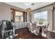 Bright dining area features a large window, stylish furnishings, and elegant decor at 19 Contrada Fiore Dr, Henderson, NV 89011