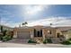 Charming single-story home with a well-manicured lawn, desert landscaping, and a spacious two-car garage at 19 Contrada Fiore Dr, Henderson, NV 89011