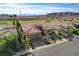 Beautiful single-story home with desert landscaping, a tile roof, and a two-car garage at 19 Contrada Fiore Dr, Henderson, NV 89011