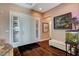 Entry foyer with hardwood floors, a front door with sidelights, and beautiful decor at 19 Contrada Fiore Dr, Henderson, NV 89011