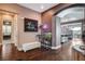 Foyer with beautiful hardwood floors, archways, and a peek into the open floorplan at 19 Contrada Fiore Dr, Henderson, NV 89011