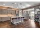 This kitchen features a center island with bar seating, stainless appliances, and ample cabinet space at 19 Contrada Fiore Dr, Henderson, NV 89011