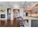 Modern kitchen featuring a large island with seating, stainless steel appliances, and pendant lighting at 19 Contrada Fiore Dr, Henderson, NV 89011