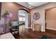 Entry foyer with hardwood floors, archways, and a peek into the open concept living spaces at 19 Contrada Fiore Dr, Henderson, NV 89011