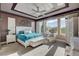 Bright and airy primary bedroom with a tray ceiling and mountain views at 19 Contrada Fiore Dr, Henderson, NV 89011