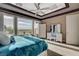 Bright main bedroom with scenic views, neutral decor, and a luxurious vanity area at 19 Contrada Fiore Dr, Henderson, NV 89011