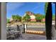 Cozy front patio with decorative chairs and mountain views, perfect for enjoying the outdoors and relaxing at 19 Contrada Fiore Dr, Henderson, NV 89011