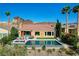 Home features pool, spa, patio, desert landscaping, and view of hills at 19 Contrada Fiore Dr, Henderson, NV 89011