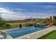 Stunning infinity pool offers amazing views of the green golf course and desert landscape at 19 Contrada Fiore Dr, Henderson, NV 89011