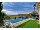 Stunning infinity pool with putting green and mountain views create an ideal outdoor oasis at 19 Contrada Fiore Dr, Henderson, NV 89011
