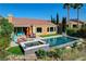 Resort-style pool and spa with lush landscaping, offering a private oasis for relaxation and recreation at 19 Contrada Fiore Dr, Henderson, NV 89011