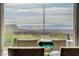 Picture window in dining area provides panoramic views of mountain and desert landscape at 19 Contrada Fiore Dr, Henderson, NV 89011