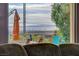 Living room view features an outdoor patio and landscape scenery at 19 Contrada Fiore Dr, Henderson, NV 89011