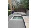 Backyard featuring a small pool, tiled patio, privacy trees, and a landscaped seating area at 2090 Morro Vista Dr, Las Vegas, NV 89135
