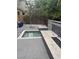 A backyard featuring a water feature, a tile-lined seating area, and an adjacent garden space at 2090 Morro Vista Dr, Las Vegas, NV 89135