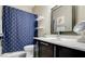 Bathroom featuring nautical themed shower curtain and mirror over modern sink and vanity at 2090 Morro Vista Dr, Las Vegas, NV 89135