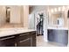 Bathroom featuring dual vanities, modern lighting, and a walk-in closet in neutral tones at 2090 Morro Vista Dr, Las Vegas, NV 89135
