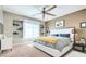 Bedroom featuring plush carpeting, large windows, recessed lighting, and a comfortable bed with bedside tables at 2090 Morro Vista Dr, Las Vegas, NV 89135