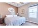 Cozy bedroom featuring neutral walls, carpeted floors, and a comfortable queen size bed at 2090 Morro Vista Dr, Las Vegas, NV 89135