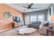 Comfortable living room with large windows, a cozy couch, carpet flooring and ample lighting at 2090 Morro Vista Dr, Las Vegas, NV 89135