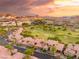 An aerial view of a neighborhood surrounding a golf course, nestled by mountains at 21 Avenida Sorrento, Henderson, NV 89011