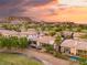 An aerial view highlighting homes with pools nestled in a scenic golf course community at 21 Avenida Sorrento, Henderson, NV 89011