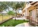 Lush backyard oasis featuring a spiral staircase, pool, and greenbelt views at 21 Avenida Sorrento, Henderson, NV 89011