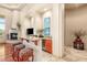 Charming bar area with stylish seating, granite counters, and a built-in wine fridge at 21 Avenida Sorrento, Henderson, NV 89011