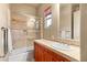 Bright bathroom featuring a shower and tub combination with natural light from a window at 21 Avenida Sorrento, Henderson, NV 89011