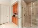 Bathroom boasting a glass shower door and functional built-in storage with custom cabinetry at 21 Avenida Sorrento, Henderson, NV 89011
