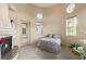 Unique bedroom features an attached fireplace and many windows offering ample natural light at 21 Avenida Sorrento, Henderson, NV 89011