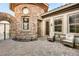Stunning stone courtyard offering comfortable seating and a decorative wrought iron gate at 21 Avenida Sorrento, Henderson, NV 89011
