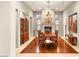 Elegant dining room featuring hardwood floors, a decorative chandelier, and classic furniture at 21 Avenida Sorrento, Henderson, NV 89011