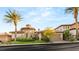 Beautiful custom home with lush landscaping and a circular stone accent at 21 Avenida Sorrento, Henderson, NV 89011