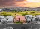 A home with desert landscaping sits amidst a golf course and mountain view at 21 Avenida Sorrento, Henderson, NV 89011