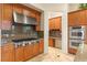 Gourmet kitchen with a gas range, double ovens, and custom cabinetry at 21 Avenida Sorrento, Henderson, NV 89011
