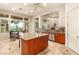 Spacious kitchen with granite countertops, an island, and stainless steel appliances at 21 Avenida Sorrento, Henderson, NV 89011