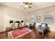 Comfortable living room offering hardwood floors, plush seating, and abundant natural light at 21 Avenida Sorrento, Henderson, NV 89011